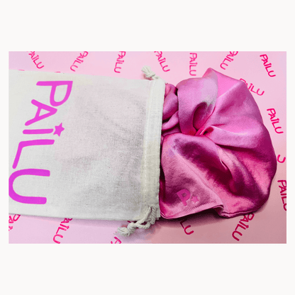 100% handmade stretch silk scrunchie in signature Pailu pink shade displayed with included dustbag