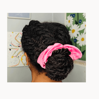 100% handmade stretch silk scrunchie in signature Pailu pink shade displayed on model